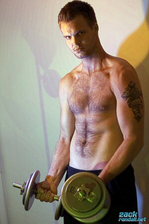 Billy Club teases with sexy poses and soft lighting in a hot gym shoot
