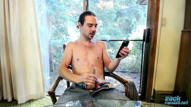 Long-haired Zack Randall licks his cock and jerks off to a big cum shot