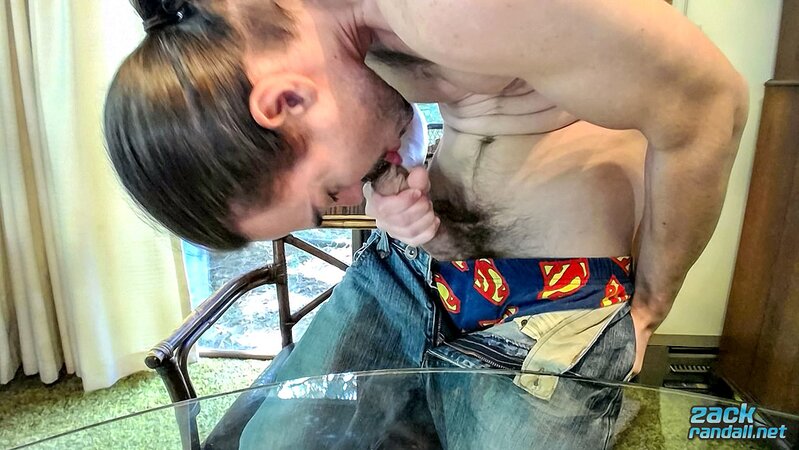 Long-haired Zack Randall licks his cock and jerks off to a big cum shot