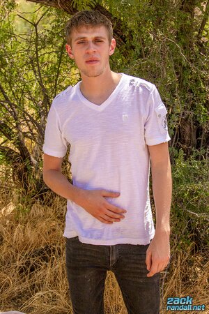 Straight Oliver Dean strokes his big cock in nature