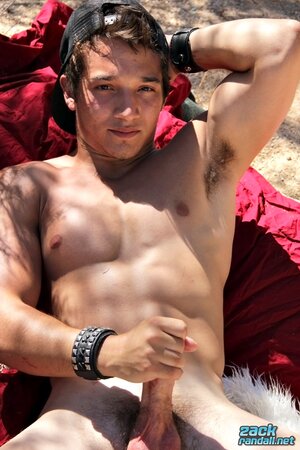 Jizzy McBone jerks off outdoors and cums all over his fit jock body