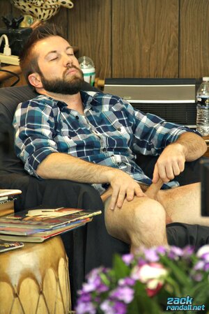 Bearded hunk Jason jerks off to pussy mags and swings his nuts around