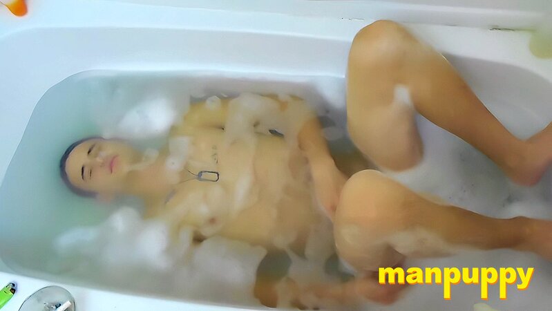 Tristan Sweet relaxes in bubbles, blowing smoke and teasing himself