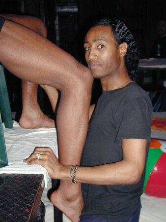 Lamar and John’s foot fetish and muscle play heats up the faux beach