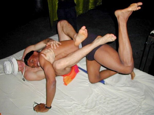 Lamar and John’s foot fetish and muscle play heats up the faux beach