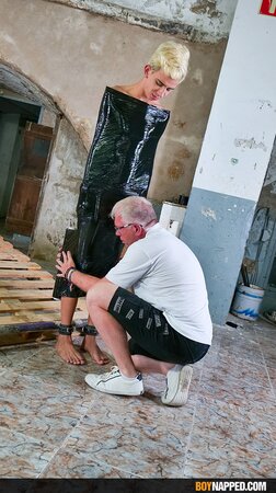 Ricky Vilela is wrapped in plastic and edged by Sebastian Kane