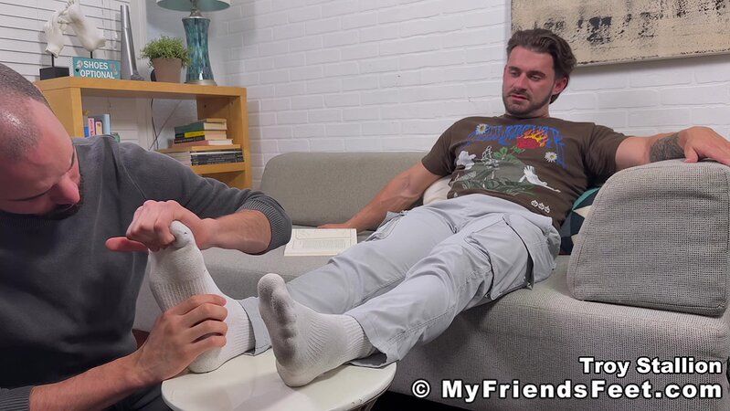 Thom sniffs Troy Stallion’s sweaty socks while he relaxes