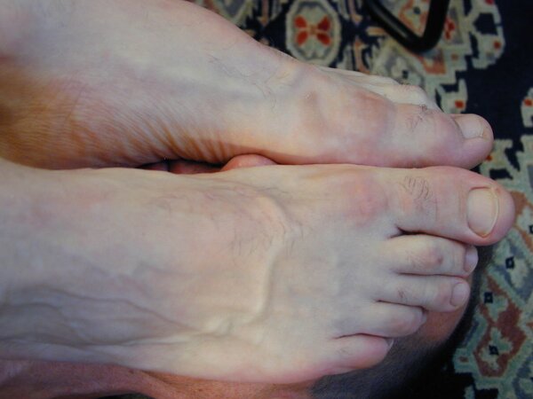 Mr. Pratt tickles Ridgeway’s feet through his sheer socks