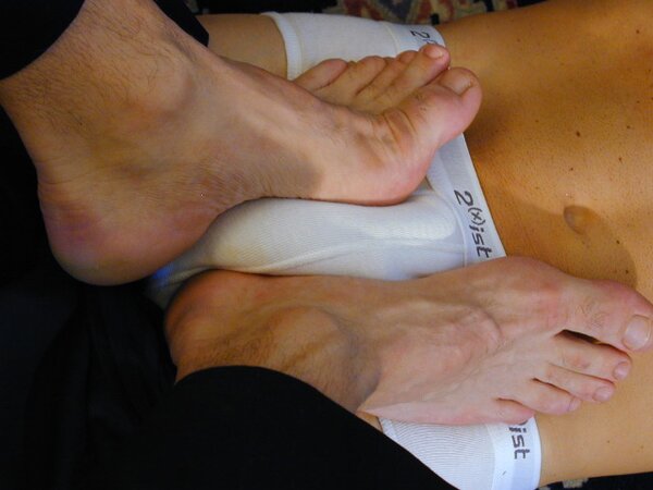 Mr. Pratt tickles Ridgeway’s feet through his sheer socks
