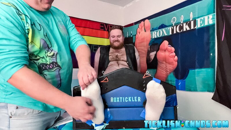 Ryan giggles and squirms under Matt’s tickling fingers