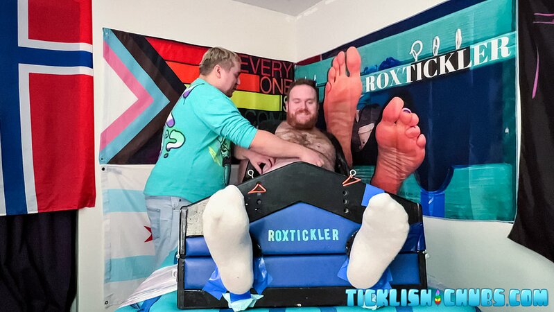 Ryan giggles and squirms under Matt’s tickling fingers
