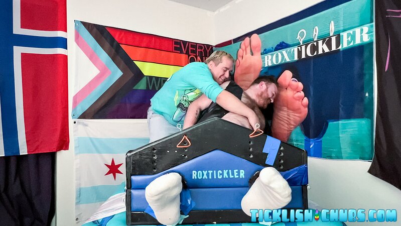 Ryan giggles and squirms under Matt’s tickling fingers