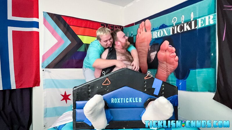 Ryan giggles and squirms under Matt’s tickling fingers