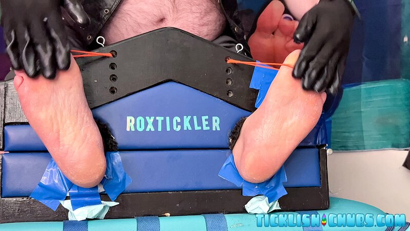 Ryan’s tickling makes Matt giggle and arch his chubby body