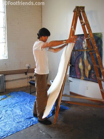 Raimondo poses with painting in foot fetish debut