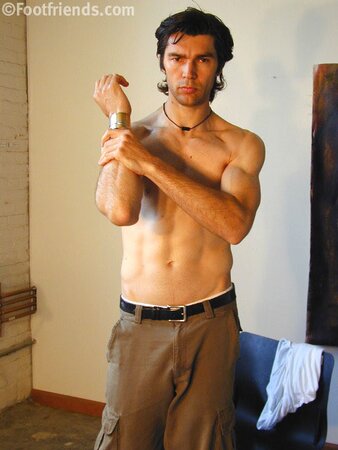 Raimondo poses with painting in foot fetish debut