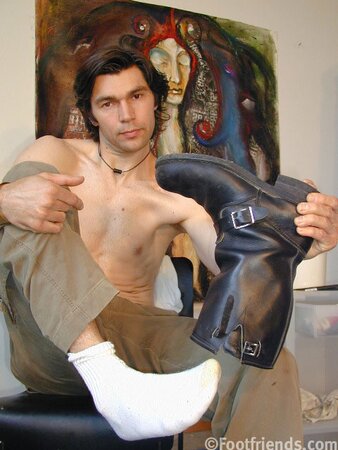 Raimondo poses with painting in foot fetish debut