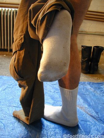 Raimondo poses with painting in foot fetish debut