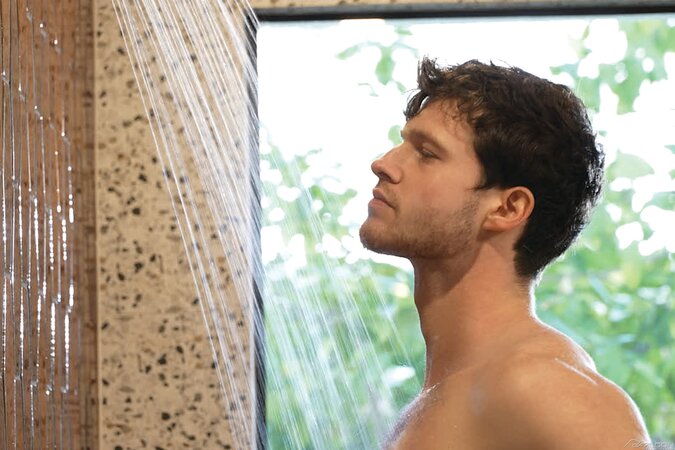 Hairy muscle man Finn Harding uses soap and water to slick his cock