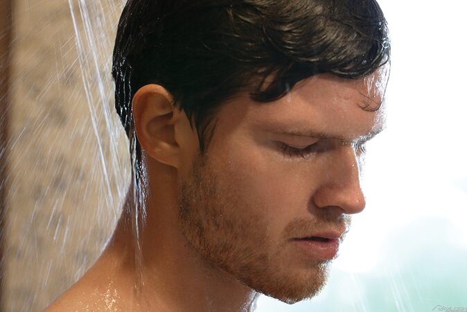 Hairy muscle man Finn Harding uses soap and water to slick his cock