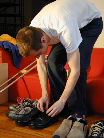 Brian Francis tries on shoes and models sexy socks for foot fetish fans