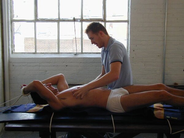 Eric tied and tickled causing uncontrollable laughter and toe worship
