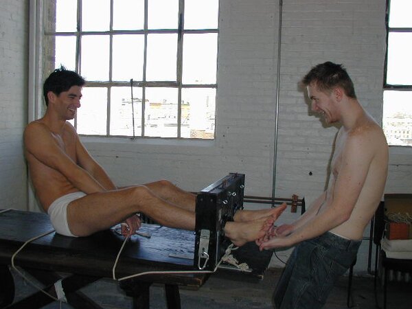 Eric tied and tickled causing uncontrollable laughter and toe worship