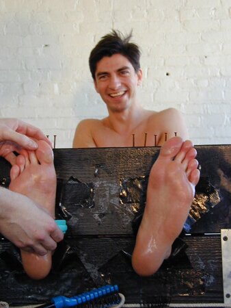 Eric tied and tickled causing uncontrollable laughter and toe worship