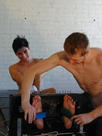 Eric tied and tickled causing uncontrollable laughter and toe worship