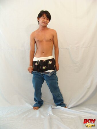 Asian twink fingers his hole then strokes his thick cock