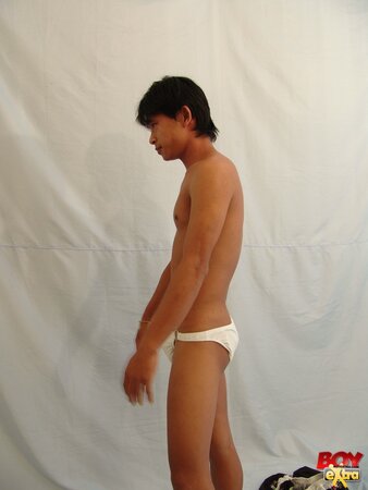 Asian twink fingers his hole then strokes his thick cock