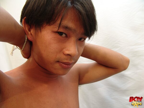 Asian twink fingers his hole then strokes his thick cock