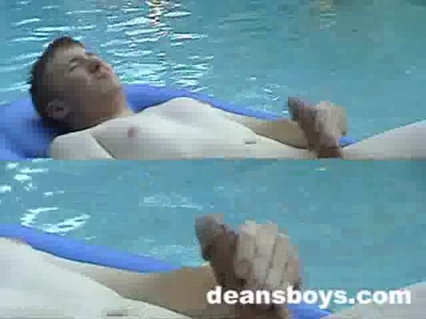 Jeffrey Cole floats poolside jerking his perfect cock