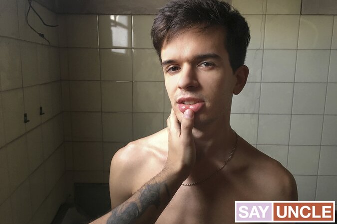 Sebastian licks cum off his lips after getting fucked