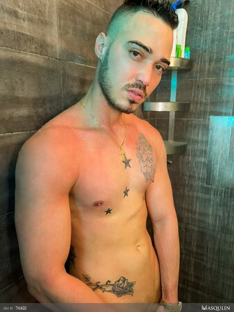 Tattooed Thiago jerks uncut cock in shower with Fleshjack toy