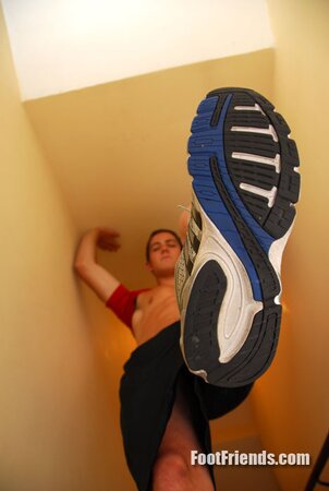 Tied Bradley plays with dirty feet for the camera