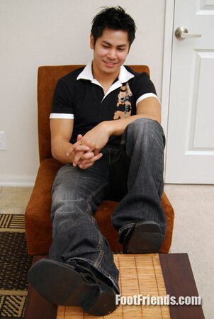 Asian muscle Scorpio shows off big feet in black socks