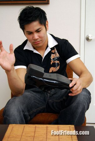 Asian muscle Scorpio shows off big feet in black socks