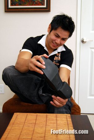 Asian muscle Scorpio shows off big feet in black socks