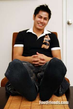 Asian muscle Scorpio shows off big feet in black socks