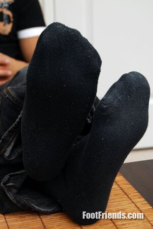 Asian muscle Scorpio shows off big feet in black socks