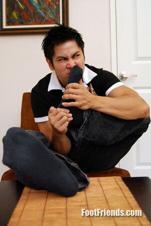 Asian muscle Scorpio shows off big feet in black socks