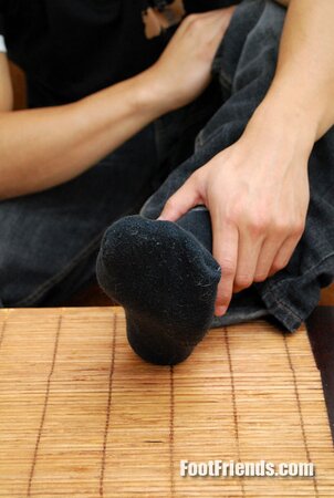 Asian muscle Scorpio shows off big feet in black socks