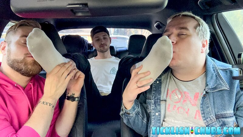 Dimitri giggles as Ryder and Matt tickle his propped-up feet