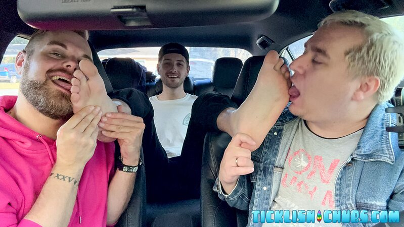 Dimitri giggles as Ryder and Matt tickle his propped-up feet