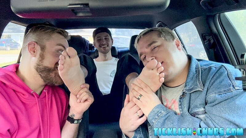 Dimitri giggles as Ryder and Matt tickle his propped-up feet