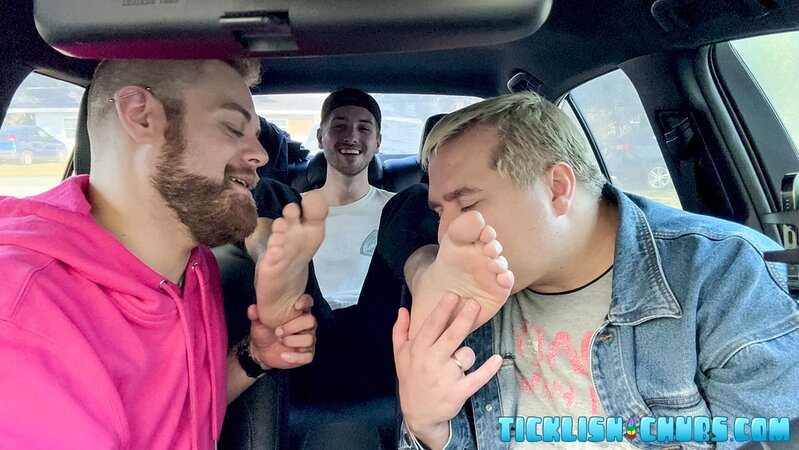 Dimitri giggles as Ryder and Matt tickle his propped-up feet