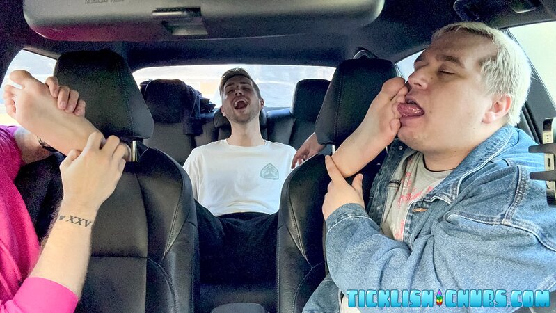 Dimitri giggles as Ryder and Matt tickle his propped-up feet