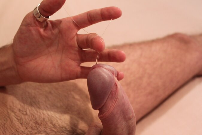 Mature Dylan Thompson shows off his huge curved cock outdoors