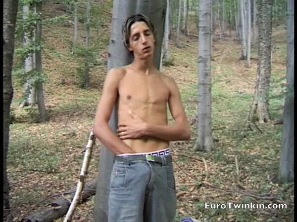 Young twink Vladimir jerks thick uncut cock outdoors